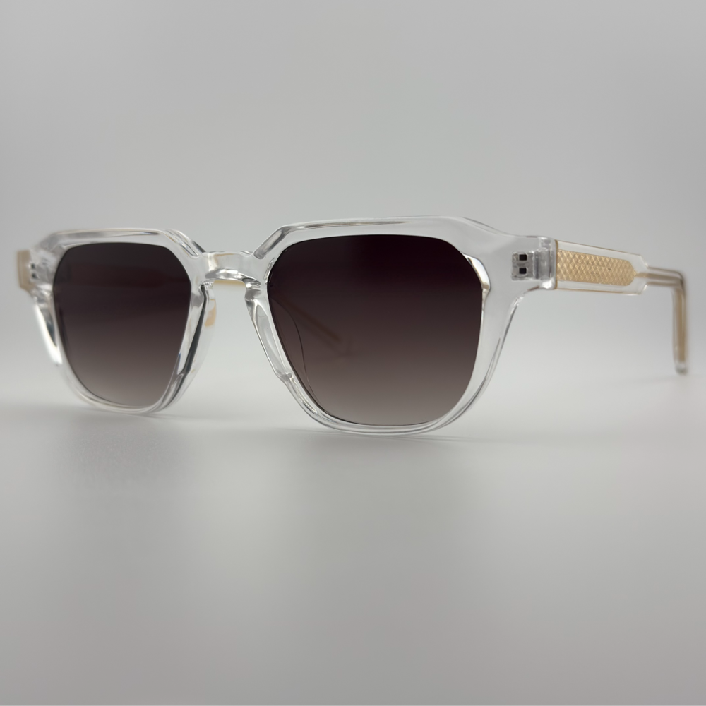 Velra PRISMA SMOKE – lunettes de soleil, vue 3/4 latérale : monture transparente et verres fumés marron dégradé.
