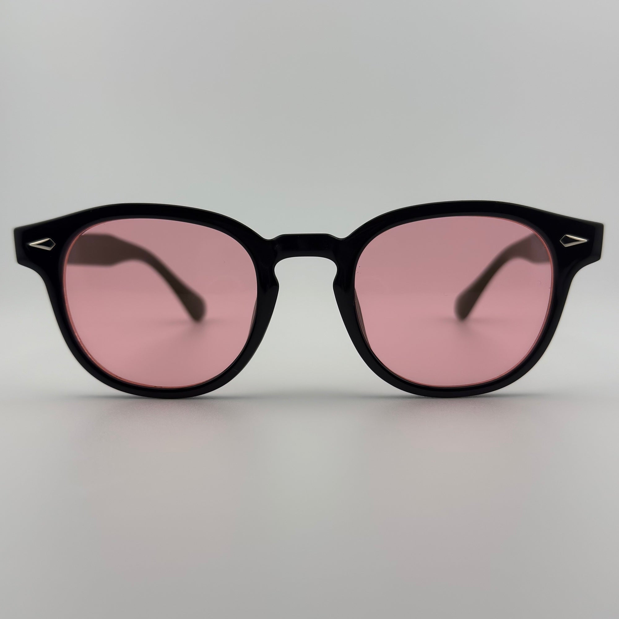 Velra Velden lunettes de soleil noir, vue de face – forme ronde classique et verres roses pour une touche rétro chic.
